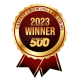 A gold and red ribbon badge reads